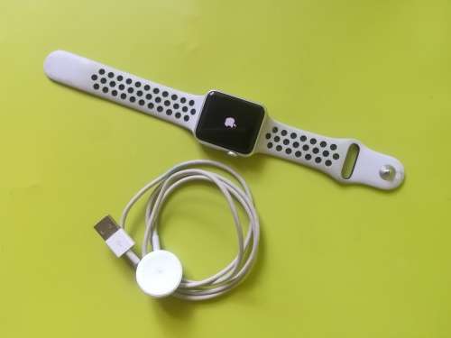 Advanced Series 1 Apple Watch (with white/grey nike strap and charger)