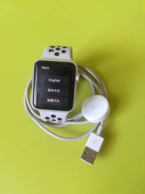 Advanced Series 1 Apple Watch (with white/grey nike strap and charger)