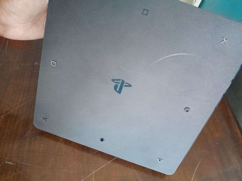 Pre owned ps4 SLIM with 2 games and cooling fan with charging port