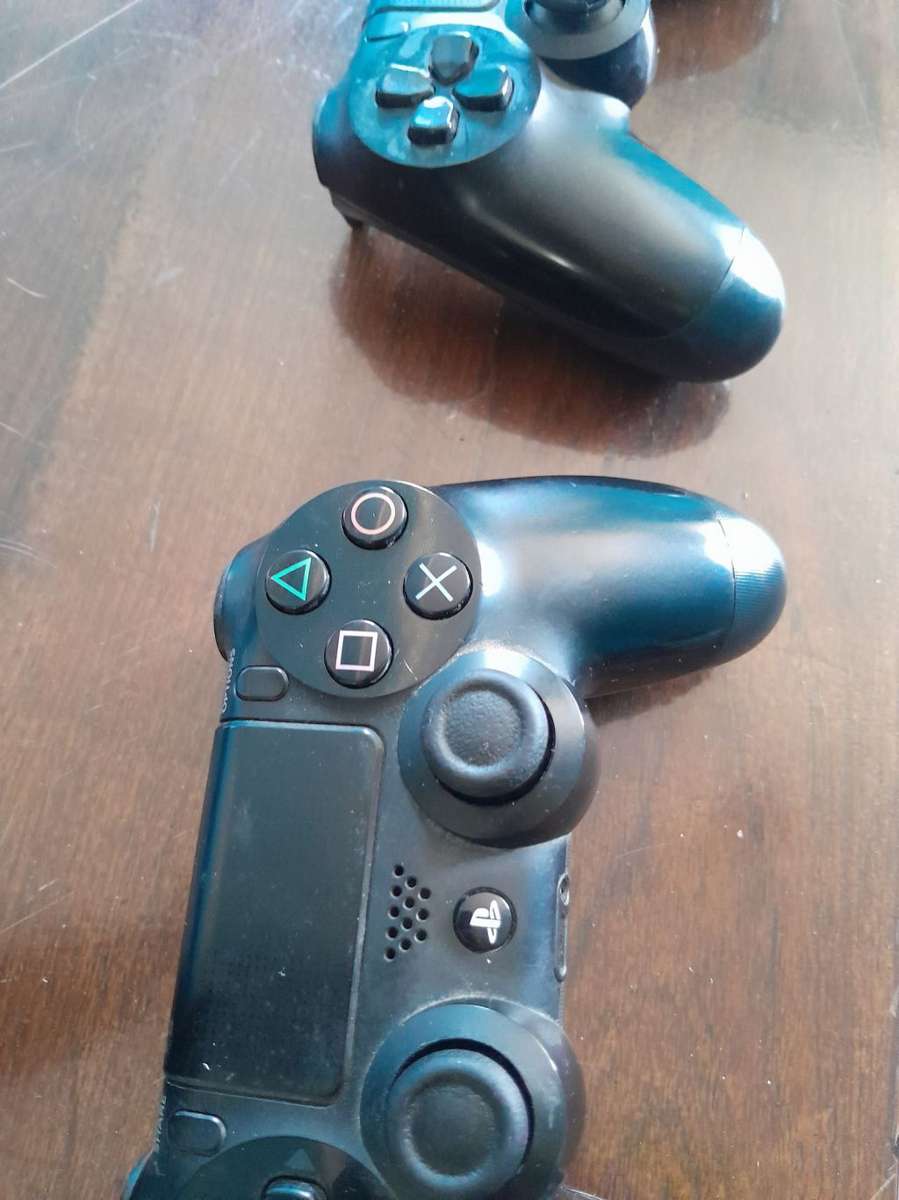 Pre owned ps4 SLIM with 2 games and cooling fan with charging port