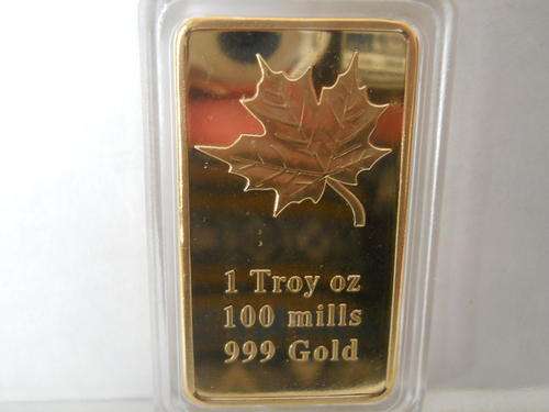 GOLD PLATED 1 OZ. REPLICA BAR. IN CAPSULE.