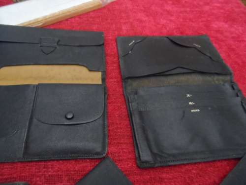 Vintage leather wallets  and a checkbook holder all in good condition.