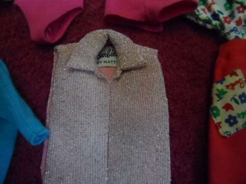 Lovely lot of genuine Barbie clothing.
