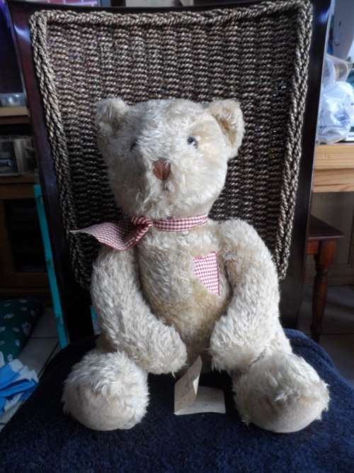 Beautiful vintage Russ bear with checkered heart and bow.  Sitting and quite large