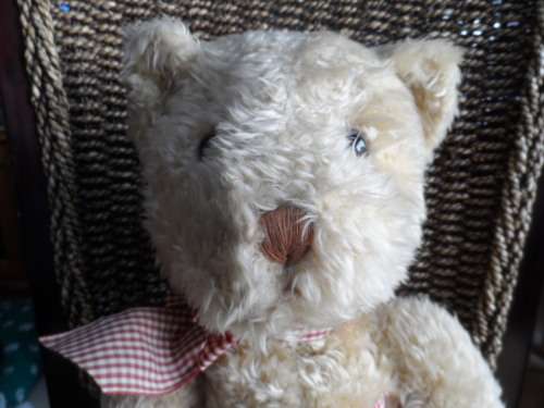 Beautiful vintage Russ bear with checkered heart and bow.  Sitting and quite large