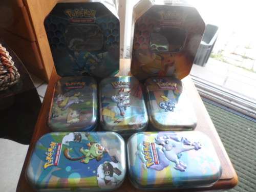 Beautiful pokemon tins look beautiful for cards 5 smaller and 2 larger all different