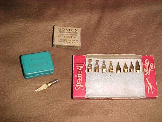 Set of speedball nibs and a pencil sharpener pair of cutters