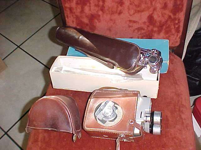 Vintage camera in leather bag with tripod in its own leather bag and box