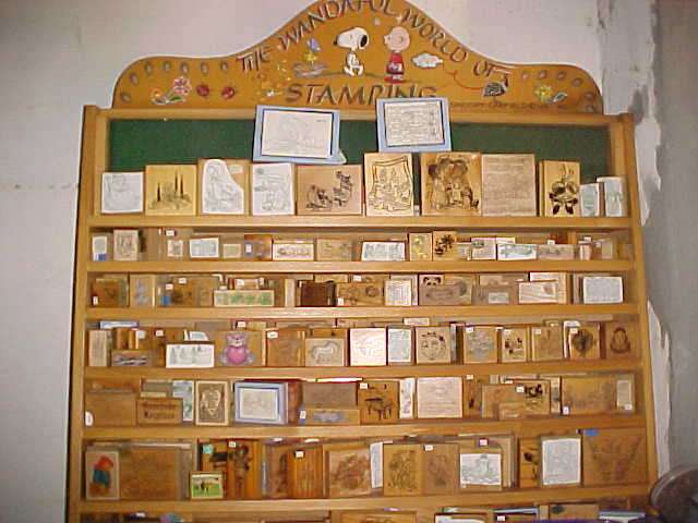 Very large lot of rubber stamps and accessories with shelf unit