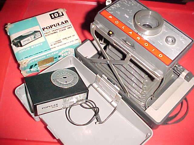 Vintage Polaroid Automatic 220 Land Camera and popular electronic flash