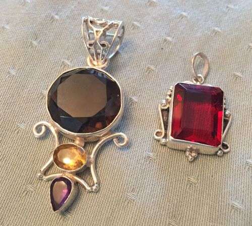 Two large sterling silver and stone pendants