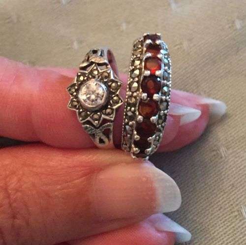 Two sterling silver rings garnets, marcasite and pale topaz stones