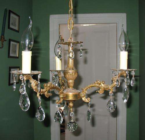 Vintage brass chandelier with crystal drops
