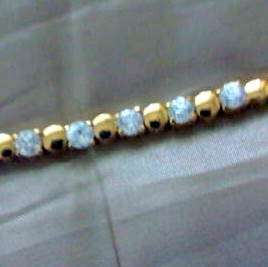 BEAUTIFUL TENNIS BRACELET IN 18CT GOLD PLATED 925 SILVER WITH DIAMOND C Z.  7 " /18 cms.