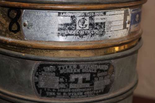 9 piece set of Copper and Brass Laboratory test sieves diameter 21cm height of stack 47cm