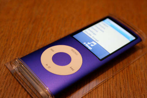 A Silver ipod nano with several songs installed onto it!