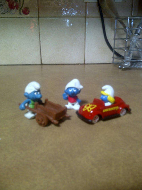 Set of smurfs, including smurfette die cast car