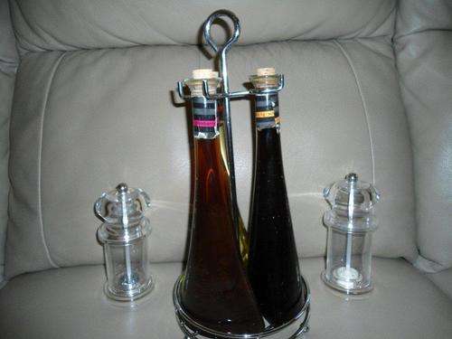 3 x liquid canister and accompanying salt and peper grinders.