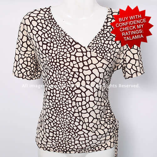 Ladies beige cream rouged stretch top with giraffe print pattern