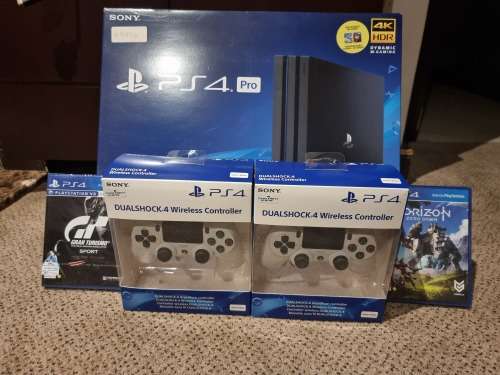 PS4 PRO 1TB EXCELLENT CONDITION INCLUDING 1 CONTROLLER THAT'S AND 2 NEW GAMES. PRICE NEGOTIABLE