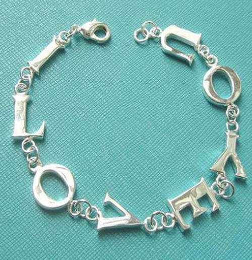 With FREE silver polishing cloth - Stunning silver "I love you" bracelet