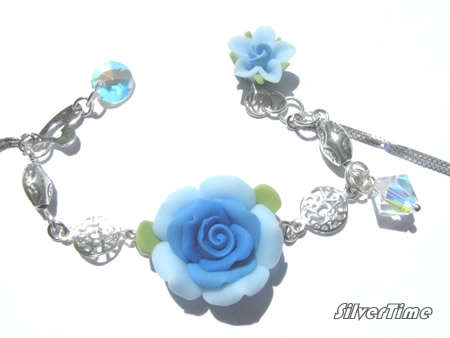 Genuine Swarovski Crystal Beads and Clay Flowers on Sterling Silver Bracelet