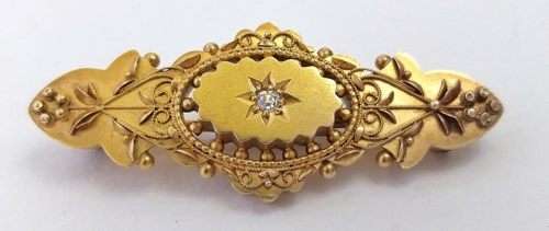 Victorian 15 carat gold sweetheart brooch set with a diamond