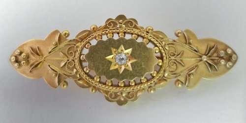 Victorian 15 carat gold sweetheart brooch set with a diamond