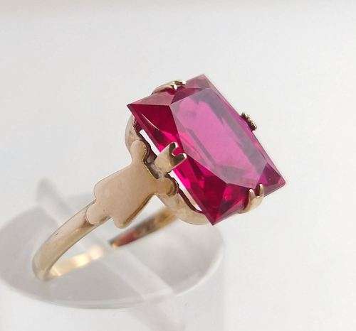 Pink square cut solitaire ring set in gold