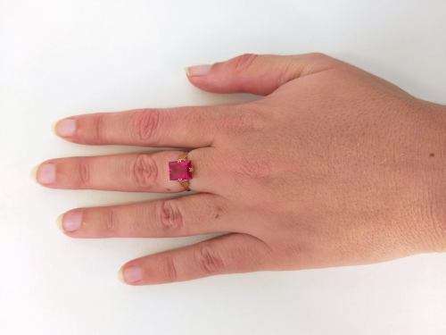 Pink square cut solitaire ring set in gold