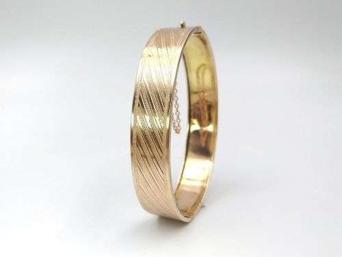 Spectacular 9ct rose gold hinged bangle (solid)