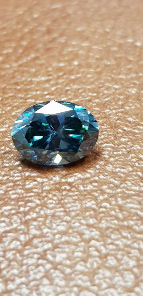 1.27cts Moissanite Brilliant Oval cut Mixed Blue Color