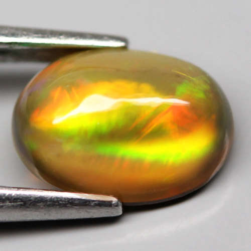 0.78Ct. Natural Opal Oval Cabochon Multi Colors Glittering Rainbow 3D! Ethiopian