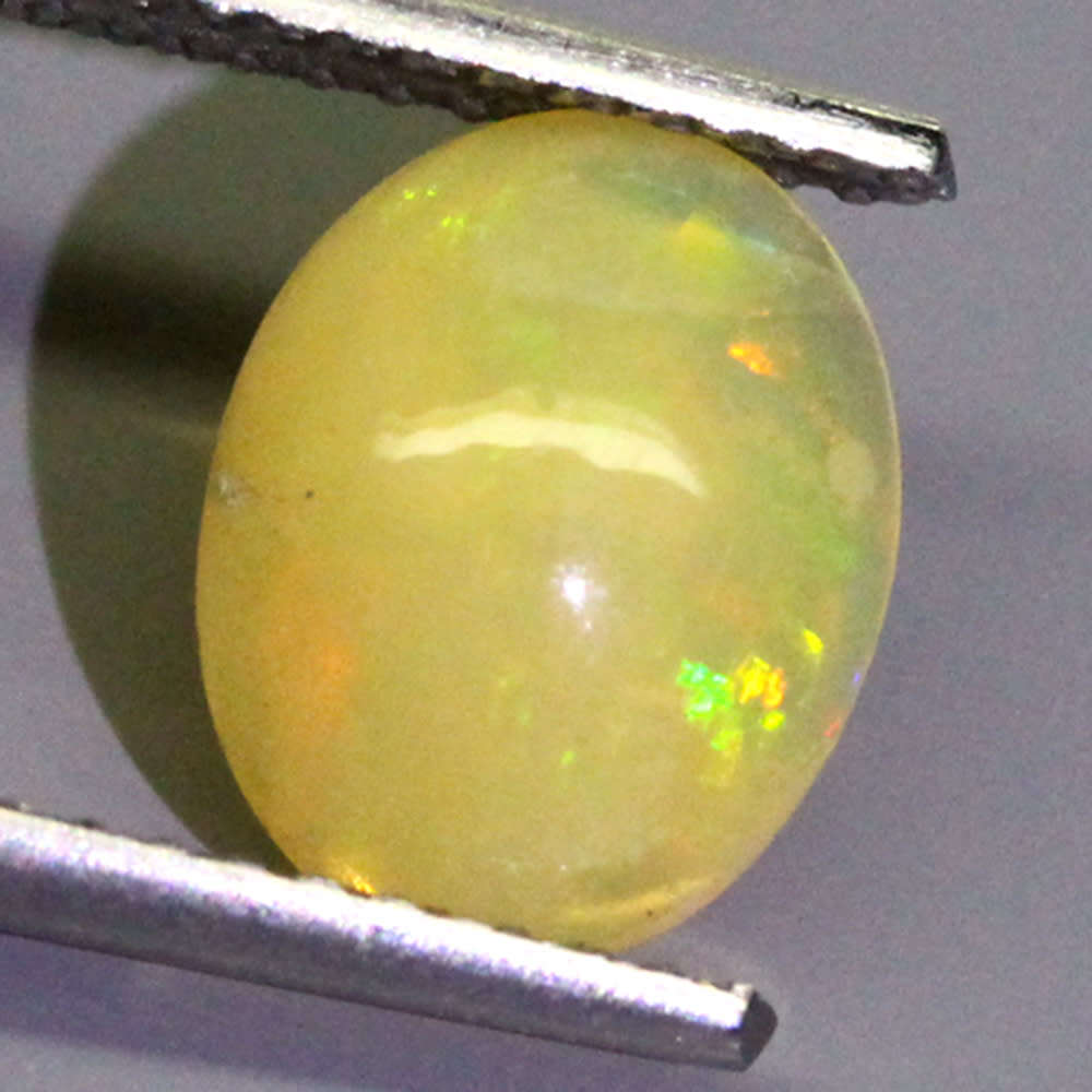 0.83Ct. Opal Oval Cabochon Yellow Multi Colours Gem Ravishing Ethiopian Natural