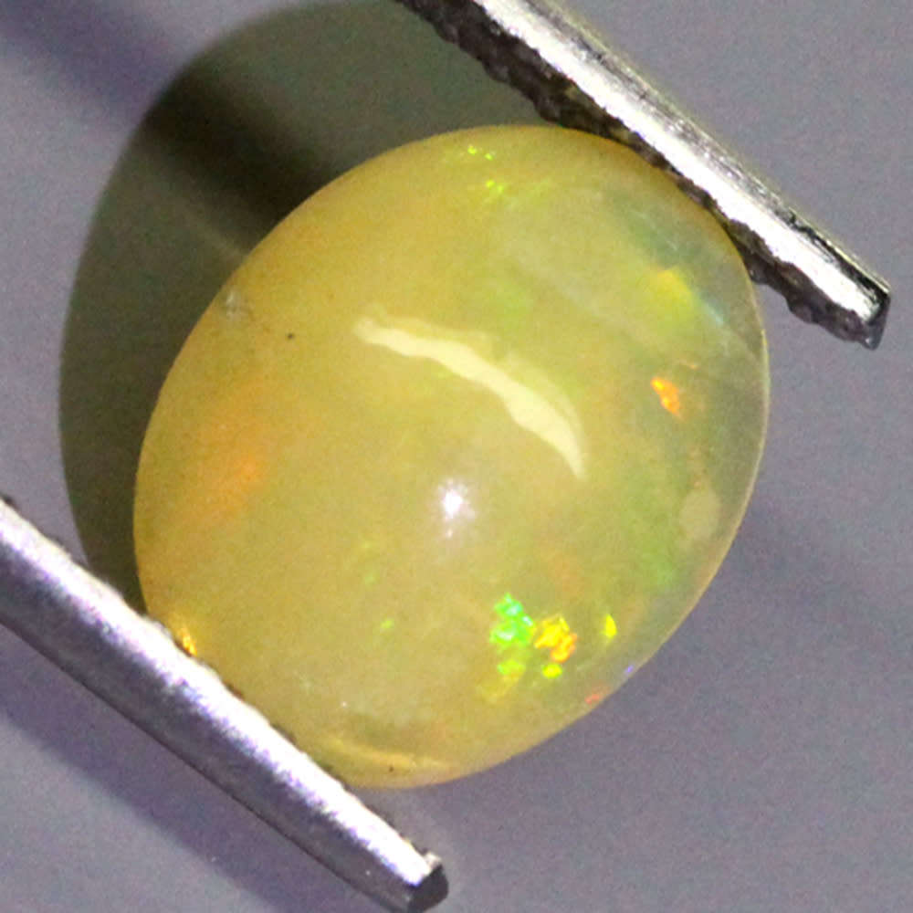0.83Ct. Opal Oval Cabochon Yellow Multi Colours Gem Ravishing Ethiopian Natural