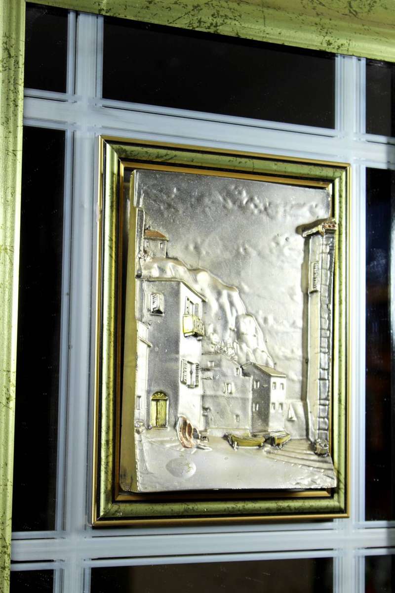 Bas-relief Artwork on a mirror - A 3D artwork - houses on the cliff