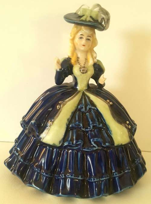 Must see musical figurine. Wind up with a crown and s stamp