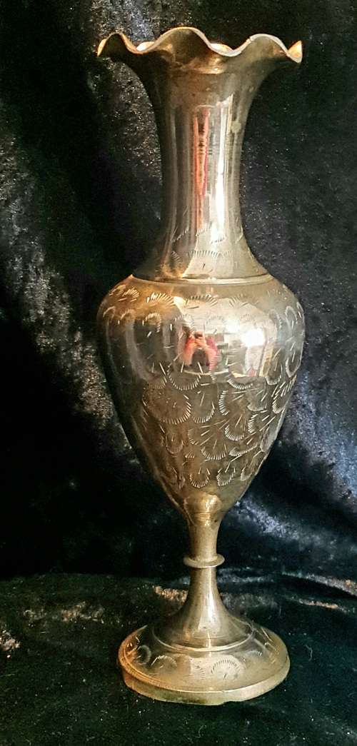 Very detailed brass vase.