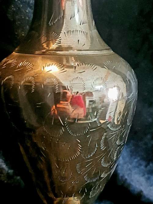 Very detailed brass vase.