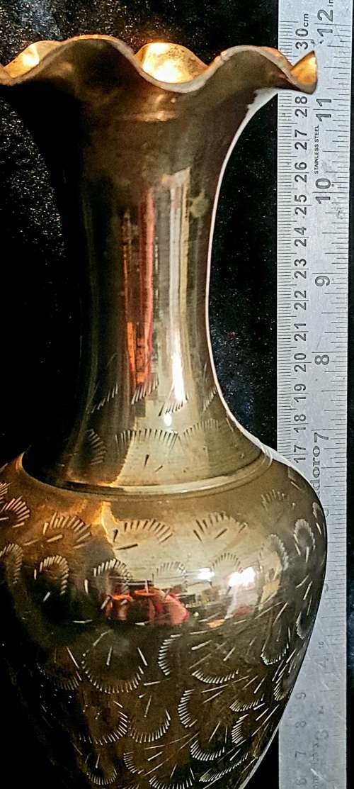 Very detailed brass vase.