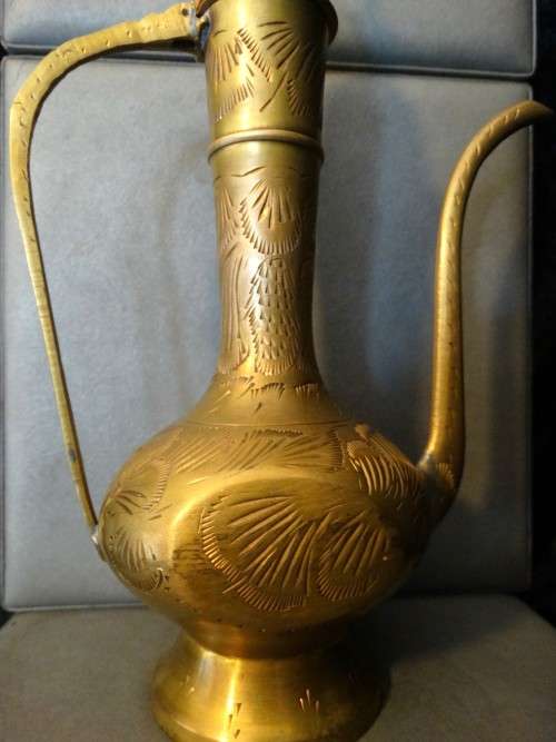 Beautiful set of etched vintage Indian teapots with intricate patterns.