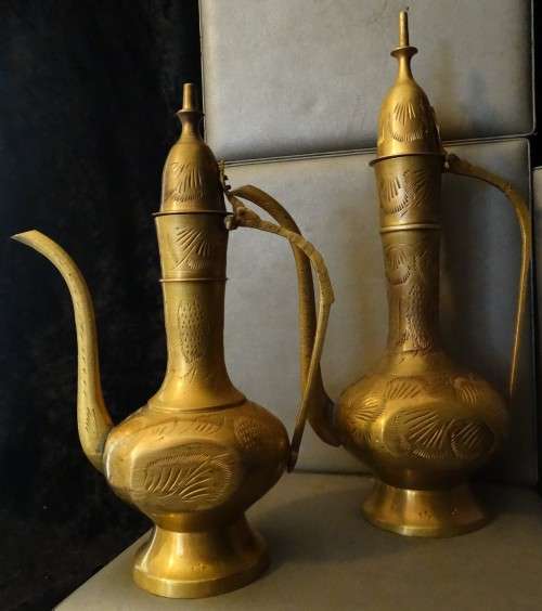 Beautiful set of etched vintage Indian teapots with intricate patterns.