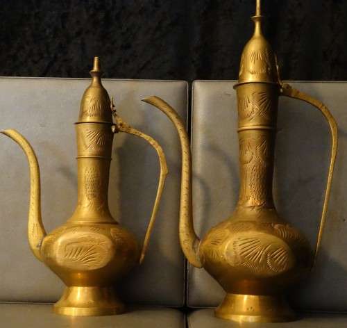 Beautiful set of etched vintage Indian teapots with intricate patterns.