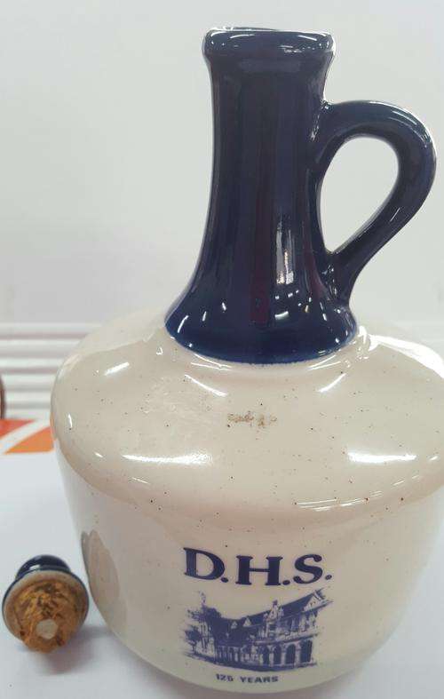 Blue and white DHS 125 years ceramic bottle with lid