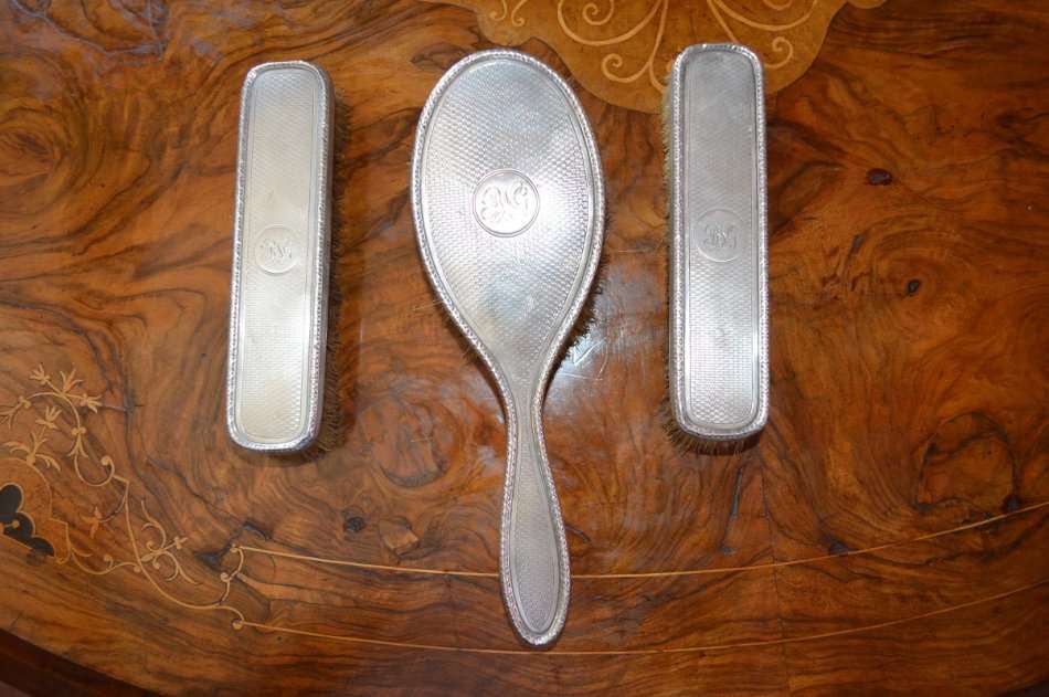 set of 3 silver hallmarked Birmingham Art Deco grooming brushes