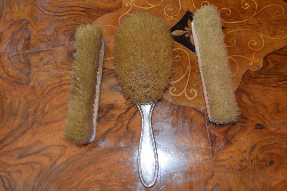 set of 3 silver hallmarked Birmingham Art Deco grooming brushes