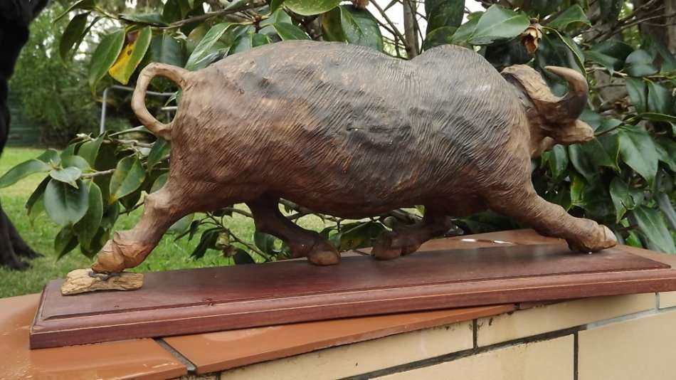 SPECIAL ### Justice Ncube large from the 80`s ironwood carved buffalo of rosewood base