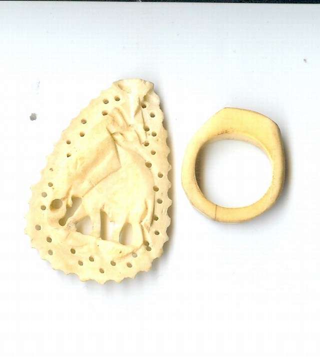 Ivory pendant with carved elephant and ivory ring
