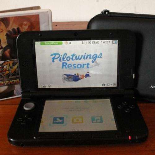Nintendo 3DS XL (Includes 2 Games, Hard Pouch and SD Card)