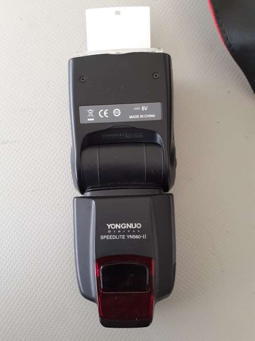 Used Canon 5D camera with Canon 50 mm f1.8 lens plus battery , charger and  plus Yongnuo speedlite a